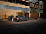 Kia Sorento 2025 PHEV donkergrijs zijkant aan het opladen